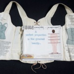 An open corset with written words on the inside.