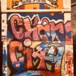 A graffiti style work of art that reads, Charm City.