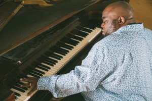 Scott Patterson plays a vintage piano.