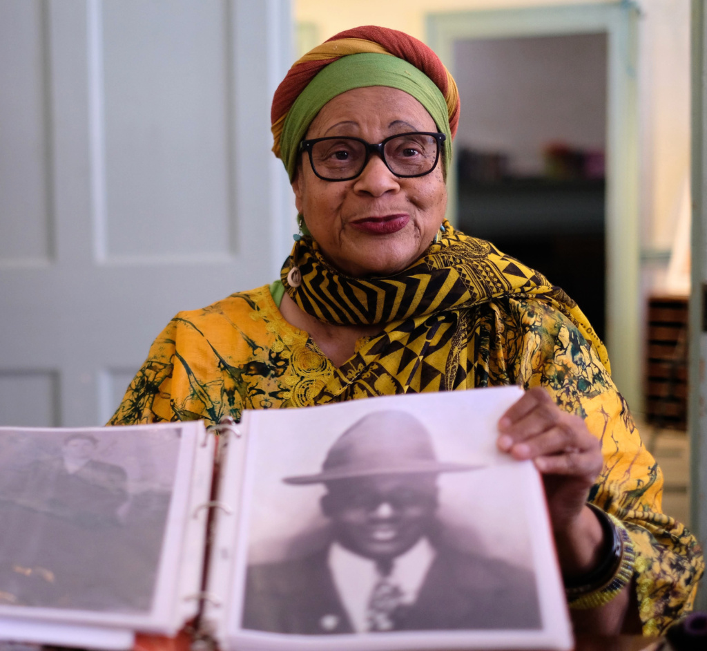 Mama Linda holds up a vintage photo.