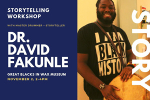 Dr.Dr. David Fakunle stands with a drum.