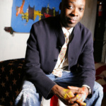 Artist Jeffrey Kent wears a black blazer and jeans.