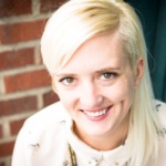 Robin Marquis has blonde hair, which is cropped on one side.