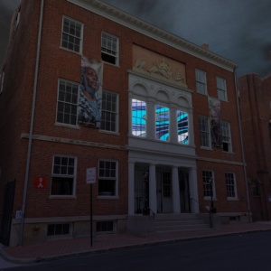 A view of the Peale building at night with its second floor windows illuminated.